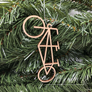 Wooden tandem bicycle ornament on greenery